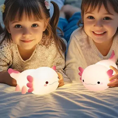 Deux fillettes heureuses avec veilleuse bébé LED sécurisée et douce