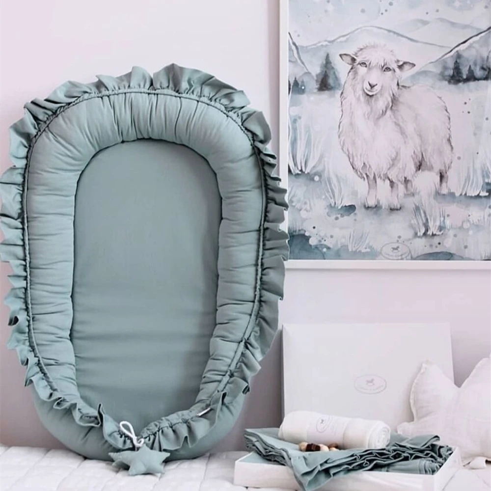 Réducteur de lit bébé