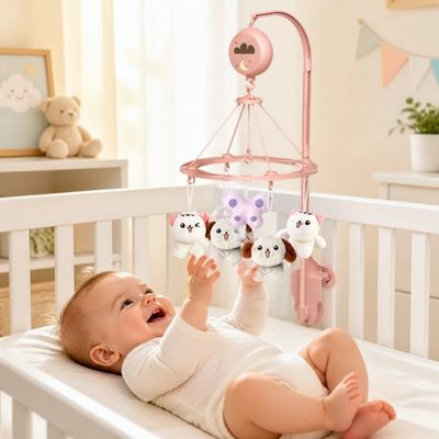 Bébé s'amusant sous le mobile bébé musical et lumineux
