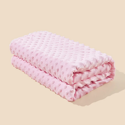 Couverture polaire pour bébé rose minky à bulles pliée