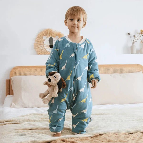 Gigoteuse a pied dinosaure porte par un bébé