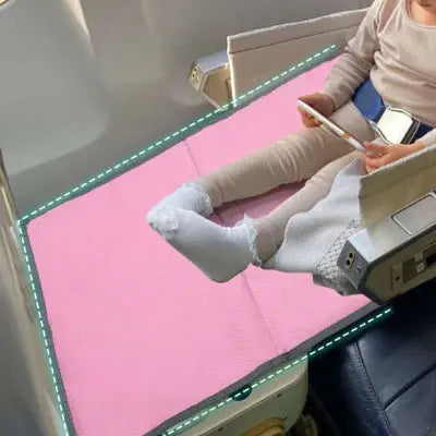 Lit de voyage bébé pose-pieds de l'avion rose