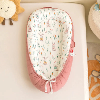  Nid réducteur de lit bébé rose