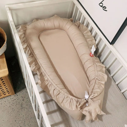 Réducteur de lit bébé Nid Portable – bébé endormi dans nid