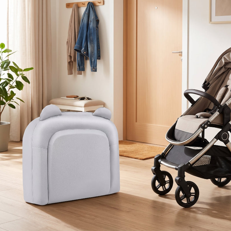 Réducteur de lit bébé pliable plié en sac, prêt à partir près de la poussette