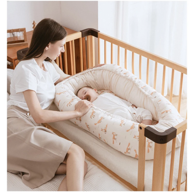 Nid bébé réducteur de lit imprimé crème 